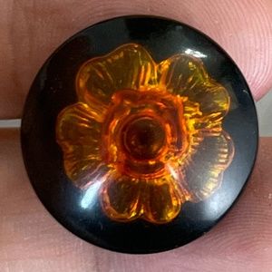 Vintage Chanel Brown Amber Camellia Large Round Shank Button on Black Background